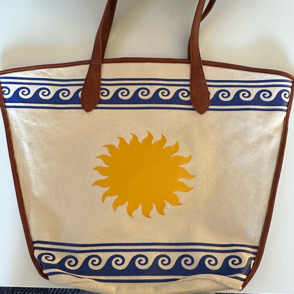 Poppy Lissiman canvas tote with leather handles with wave and sun design